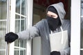 Burglar Breaking Into House And Stealing Laptop Computer Royalty Free Stock Photo