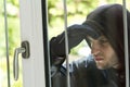 Burglar breaking in a house Royalty Free Stock Photo