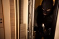 Burglar breaks into a apartment Royalty Free Stock Photo