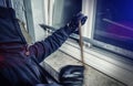 Burglar with crowbar break door to enter the house Royalty Free Stock Photo