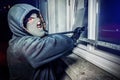 Burglar with crowbar break door to enter the house Royalty Free Stock Photo