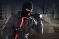 Burglar With A Crowbar And A Flashlight Royalty Free Stock Photo