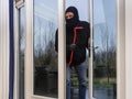 Burglar with a crowbar Royalty Free Stock Photo