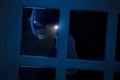 Burglar with flashlight Royalty Free Stock Photo