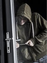 Burglar forcing door Royalty Free Stock Photo