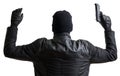 Burglar masked with balaclava is putting hands up and gives up.