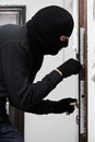 Burglar thief at house breaking Royalty Free Stock Photo