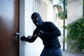 Burglar trying to force a door lock