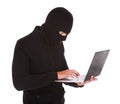 Burglar using laptop