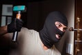 The burglar wearing balaclava mask at crime scene Royalty Free Stock Photo