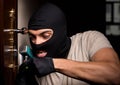 Burglar wearing balaclava mask at crime scene Royalty Free Stock Photo