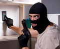 Burglar wearing balaclava mask at crime scene Royalty Free Stock Photo