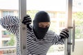 Burglarize try to break into the room to steal Royalty Free Stock Photo