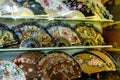 Burgos, Spain - August 25, 2021. Colorful fans for souvenir of tourists in Spain