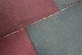 Burgundy and gray artificial turf tiles at a children`s playground placed at an angle Royalty Free Stock Photo