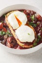 Burgundy Poached Egg in Red Wine Sauce on Toast Oeuf en Meurette closeup on the plate. Vertical Royalty Free Stock Photo