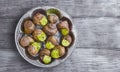 Burgundy snail on a plate Royalty Free Stock Photo