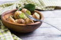 Burgundy snail on a wooden tray Royalty Free Stock Photo