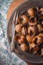 Burgundy snails on the napkin pattern background vertical