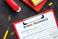 BURIAL INSURANCE Application Form sign on the financial document Royalty Free Stock Photo