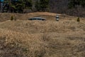 Burial mound next to spirit house