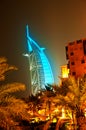 Burj Al Arab glowing at night in Cyan Royalty Free Stock Photo