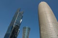 Burj Doha (Burj Qatar, Doha Tower), QIPCO Tower and Palm Tower against clear blue sky, close up view Royalty Free Stock Photo