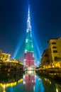 BUrj Khalifa Tower floodlit in the white, green and red colors