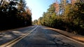 POV driving country low to the ground fall season curvy road