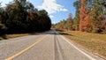 POV driving country road blue sky fall seasonal scenery