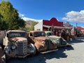 Burkes Pass , New Zealand - Febuary 09 2024: Rusty old classic cars in a metal scrap yard Royalty Free Stock Photo