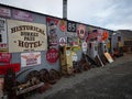 Burkes Pass Village, Canterbury New Zealand - 2023: Old historic outdoor museum street road signs with rusty wheel rims Royalty Free Stock Photo