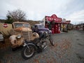 Burkes Pass Village, New Zealand - 2023: Old motorbike and rusty classic cars with Texaco historic gas station fuel pump Royalty Free Stock Photo