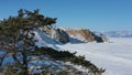 Burkhan rock cape in frozen lake Baikal