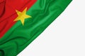 Burkina Faso flag of fabric with copyspace for your text on white background