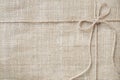 Burlap background tie with rustic burlap twine, natural product