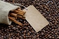 Burlap bag with cinnamon and coffee raw beans and sale label Royalty Free Stock Photo