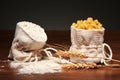 Burlap bags of flour and dry cavatappi pasta, wheat ears Royalty Free Stock Photo