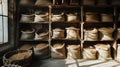 Burlap bags of grain stored in rustic warehouse shelves
