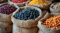 burlap bags overflowing with a diverse array of beans, including black, red, yellow long-legged, green round-shaped