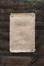 Burlap canvas with lacerate edges on old grunge Royalty Free Stock Photo