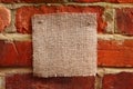 Burlap canvas with lacerate edges on red old Royalty Free Stock Photo