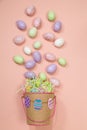 Easter basket spills speckled pastel eggs