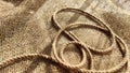 Burlap fabric, coarse jute weave, and thick burlap rope. Background, texture, pattern, and frame. Royalty Free Stock Photo