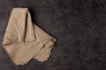 Burlap napkin on a dark structural background, top view Royalty Free Stock Photo