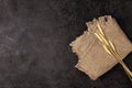 Burlap napkin on a dark structural background, top view. Ears of wheat Royalty Free Stock Photo