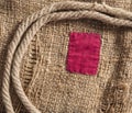 Burlap with red patch Royalty Free Stock Photo