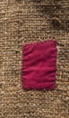 Burlap with red patch Royalty Free Stock Photo