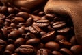 Burlap sack of coffee beans against dark wood background with whole coffee beans spilling out over wood panel Royalty Free Stock Photo