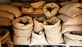 Burlap sacks stacked texture, showcasing rustic material and storage containers Generative AI Royalty Free Stock Photo